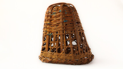 Traditional small basket (doko) in Nepali language  used for carrying items. Made of bamboo. White Background or isolated Background