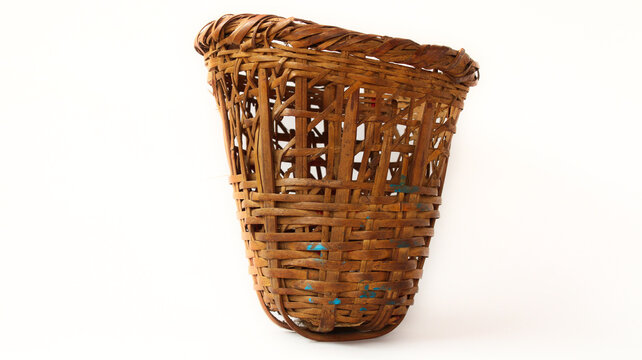 Traditional small basket (doko) in Nepali language  used for carrying items. Made of bamboo. White Background or isolated Background
