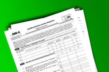 Obraz premium Form 8995-A documentation published IRS USA 01.28.2021. American tax document on colored