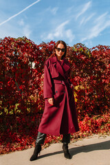 The girl is a model showing fashionable clothes on the street. Summer, the girl's back is a living fence. Showroom