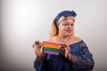 African lesbian posing with rainbow flag, she is dressed with african clothes, studio portrait
