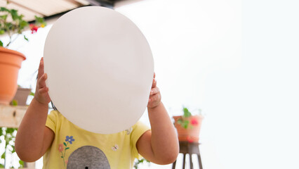 balloon in front of face