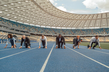 Front view photo of business team standing on race track