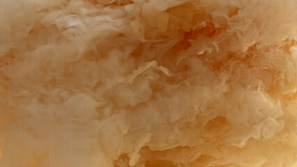 Macro shot of coffee mixing with milk.