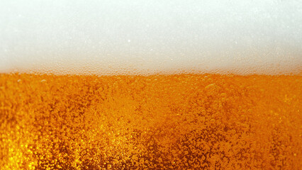 Macro photo of bubbling beer, closeup.