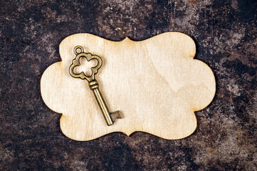 Gold vintage key on a label. Real estate, insurance, buy or sell new home.