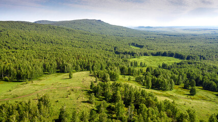 Southern Urals in spring. Ural Mountains, Irendyk ridge. Aerial view.