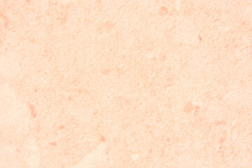 Salmon colored background. Looks like stone or granite. Suitable for text or as a background and more.