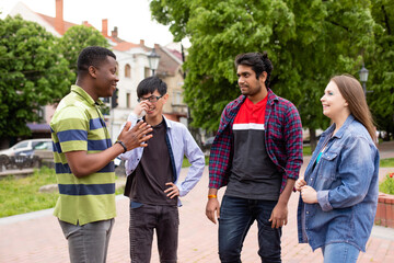 Happy diversity friends meeting outdoor in park