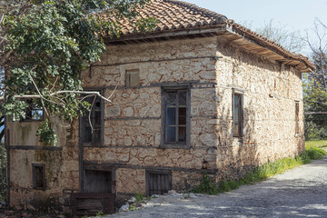 Fototapeta na wymiar old brick house on the road to the park in the village
