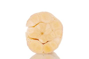 One half of early garlic, macro, isolated on white background.