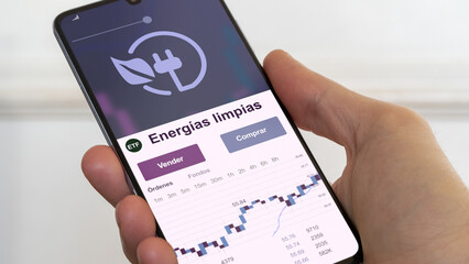 Energia limpias, energías verdes, fondo de inversión negociado en bolsa mundial, datos del mercado de valores en el teléfono. Análisis de negocios de una tendencia ETF. Blue chips. Texto en español	