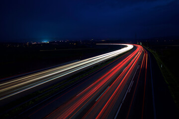 Aerial night view of the highway in speed motion effect