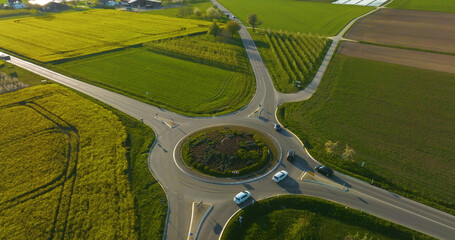 Roundabout with cars surrounded by greenery in Germany © Martin Bröckel/Wirestock Creators
