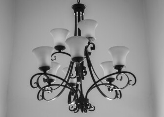 Grayscale shot of a chandelier