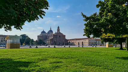 Fototapeta na wymiar Scenic view from Prato della Valle on the Abbey of Santa Giustina in Padua, Veneto, Italy, Europe. Abbey was founded in fifth century on the tomb of saint Justine of Padua in Padova, Italian city