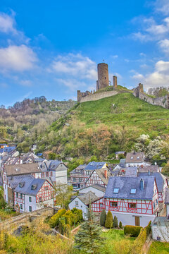 Vertical shot of the Lowenburg and Philippsburg castles on the hill in Monreal, Eifel, Germany