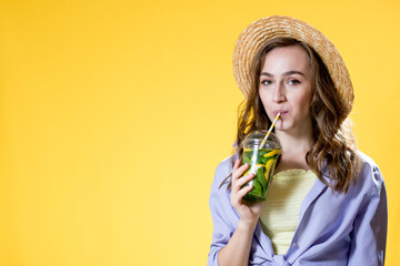 Summer refreshment. Cold beverage. young woman with plastic cup of fresh cocktail Non-alcoholic drink. Detox lemonade. Holiday relax