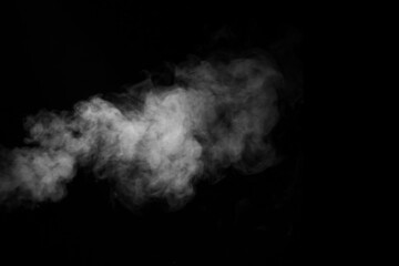 Swirling, wriggling smoke, steam, isolated on a black background for overlaying on your photos. Fragment of horizontal steam.