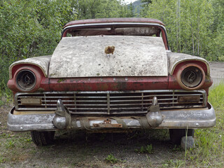 Old rusty vintage Ford car