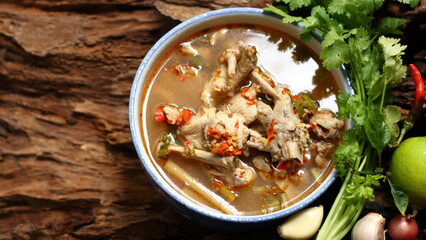 Chicken Feet Spicy Soup on wooden background