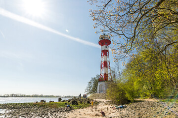 Famous lighthouse (Leuchtturm Wittenbergen) at the beach of the Elbe River in Hamburg, Germany