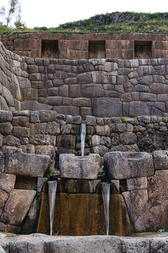 Inca water fountains at Tipon Archaeological Site during daytime in Cusco, Peru