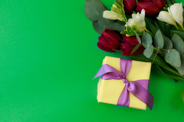 Gift box and spring flowers on color background. Stylish soft image of spring flowers. Happy womens day. Happy Mothers day.Hello Spring- Image