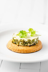 spicy creamy cheese with herbs on the biscuits 