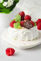 mini pavlova meringues with whipped cream and berries