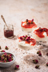 sauce and berries, panna cotta with red sauce decorated with roses