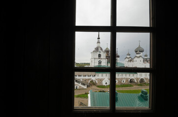View of the bell tower of the Solovetsky Monastery. View through the black window