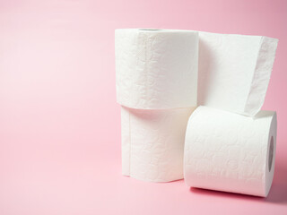 Toilet paper roll on pink background, Space for text