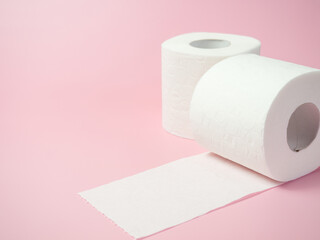 Toilet paper roll on pink background, Space for text