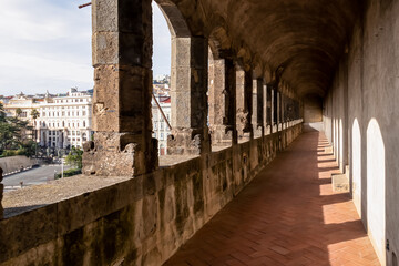 Shadows of the pillars on the balcony of the Castel Nuovo (Maschio Angioino) in Naples, Campania,...