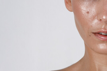 close-up girl with sweaty skin on her face and excessive oily sheen, excessive sweating,...