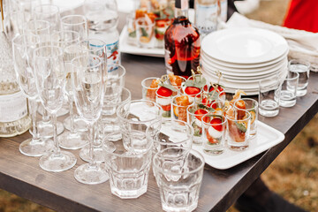 Luxury table setting for dining in a restaurant in pastel colors close up. Wedding party table set for banquet