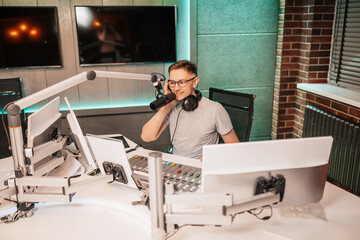 The DJ hosts the program and communicates with the audience on air at the radio station. The...