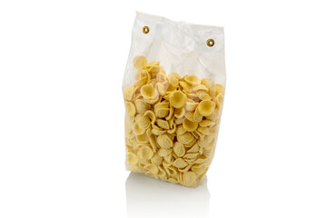 Orecchiette in transparent sealed package for sale isolated on white , Italian pasta from Puglia...