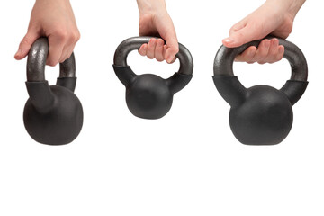 Black weight isolated on white in woman hand. 4 kg weight.