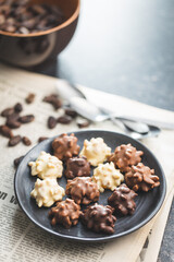 Chocolate truffles. Sweet pralines on plate.