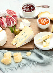 Cheese assortment on light background.