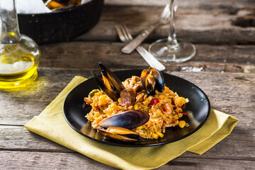 Typical spanish seafood paella in traditional pan. Spanish food. Valencian dish. Rice with seafood.