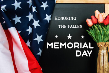 Fototapeta na wymiar American flag and a poppy flowers with Memorial Day Remember and Honor text background