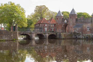 Historic land and water gate de Koppelpoort in the medieval town of Amersfoort; Netherlands.