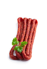 Dry cured Kabanos sausage isolated on white