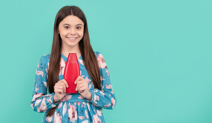 kid with shower gel. happy girl hold shampoo bottle. child with hair conditioner.