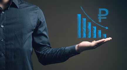 The concept of the fall of the ruble on the chart. Man holding in his hand