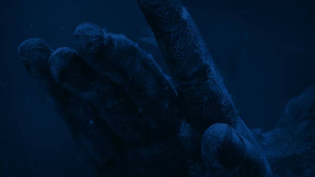 Ancient Hand Statue Underwater In Rippling Moonlight
