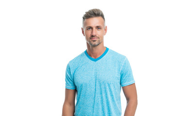 Serious handsome middleaged guy in casual style keeping hand in pocket isolated on white